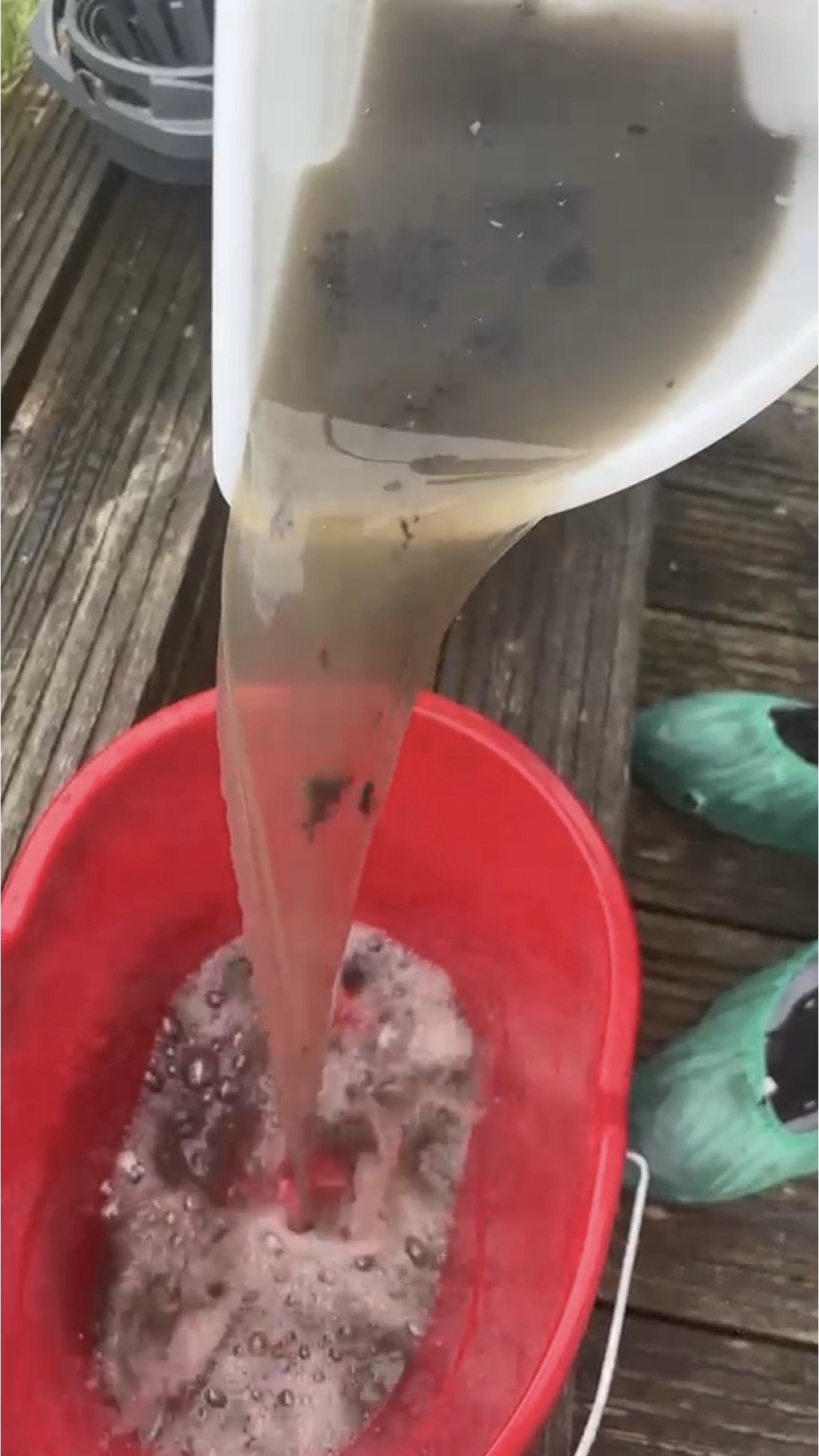 Recovered water showing soil removed during cleaning